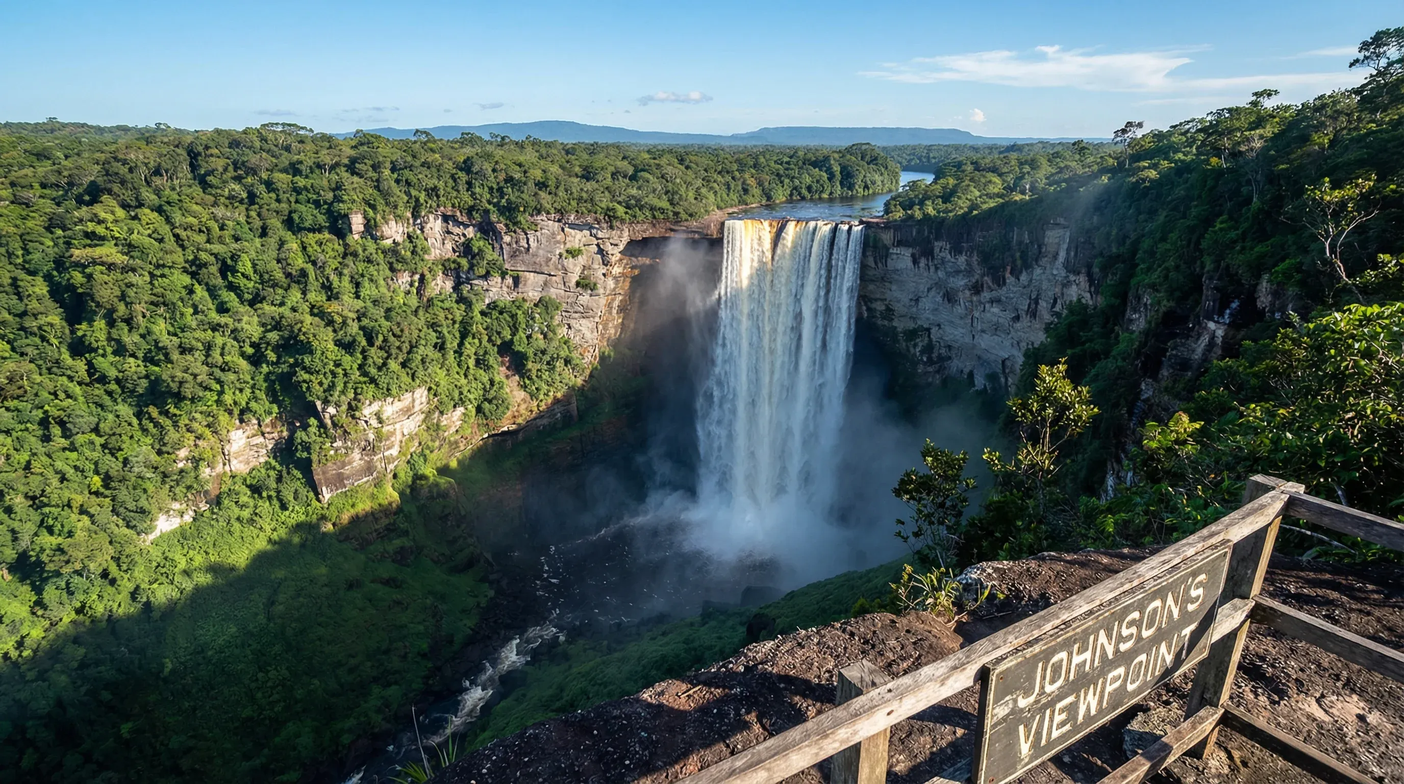 A wide-angle view of Kaieteur Falls dropping into a forested gorge in the interior of Guyana.