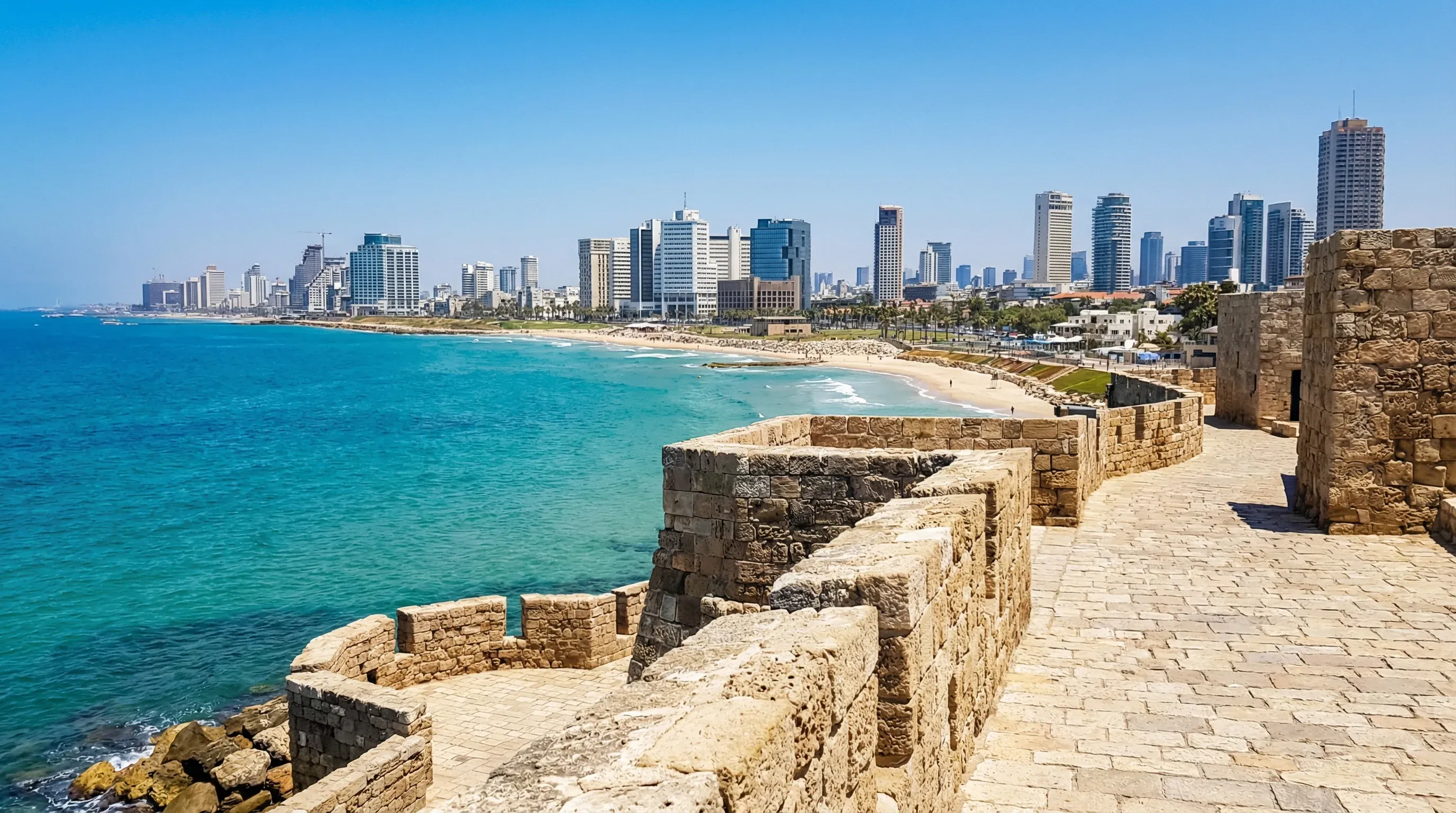 The Mediterranean coast of Tel Aviv with its sandy beaches and modern skyline as seen from the historic port of Jaffa.