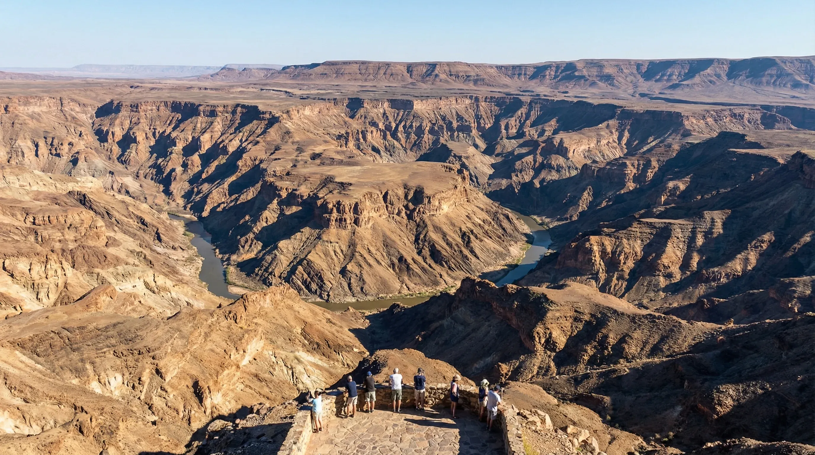 A wide view from the canyon rim overlooking the deep, winding rocky ravines of the Fish River Canyon.