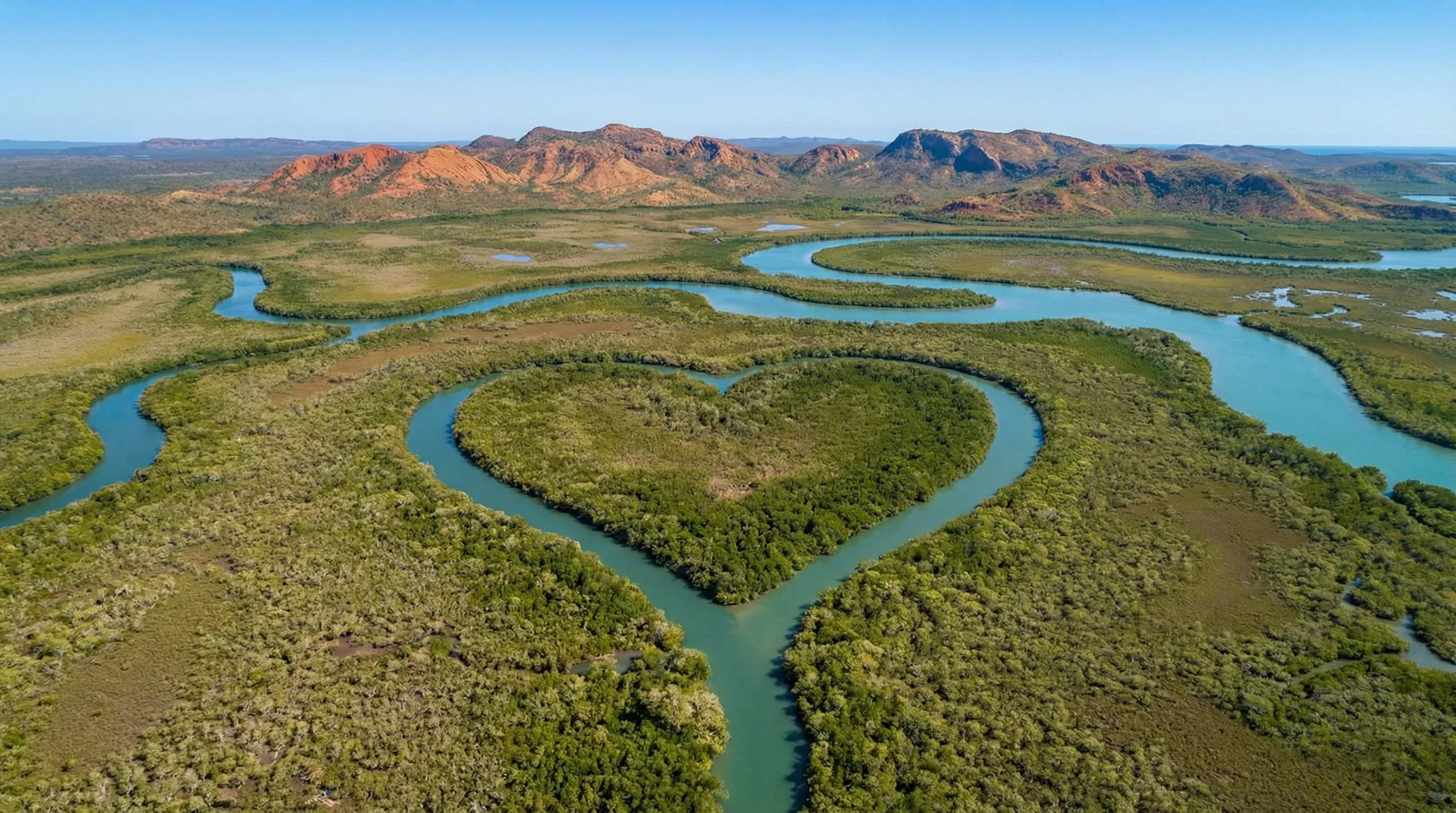An aerial view of the Heart of Voh, a natural heart-shaped mangrove formation in the Northern Province of New Caledonia.