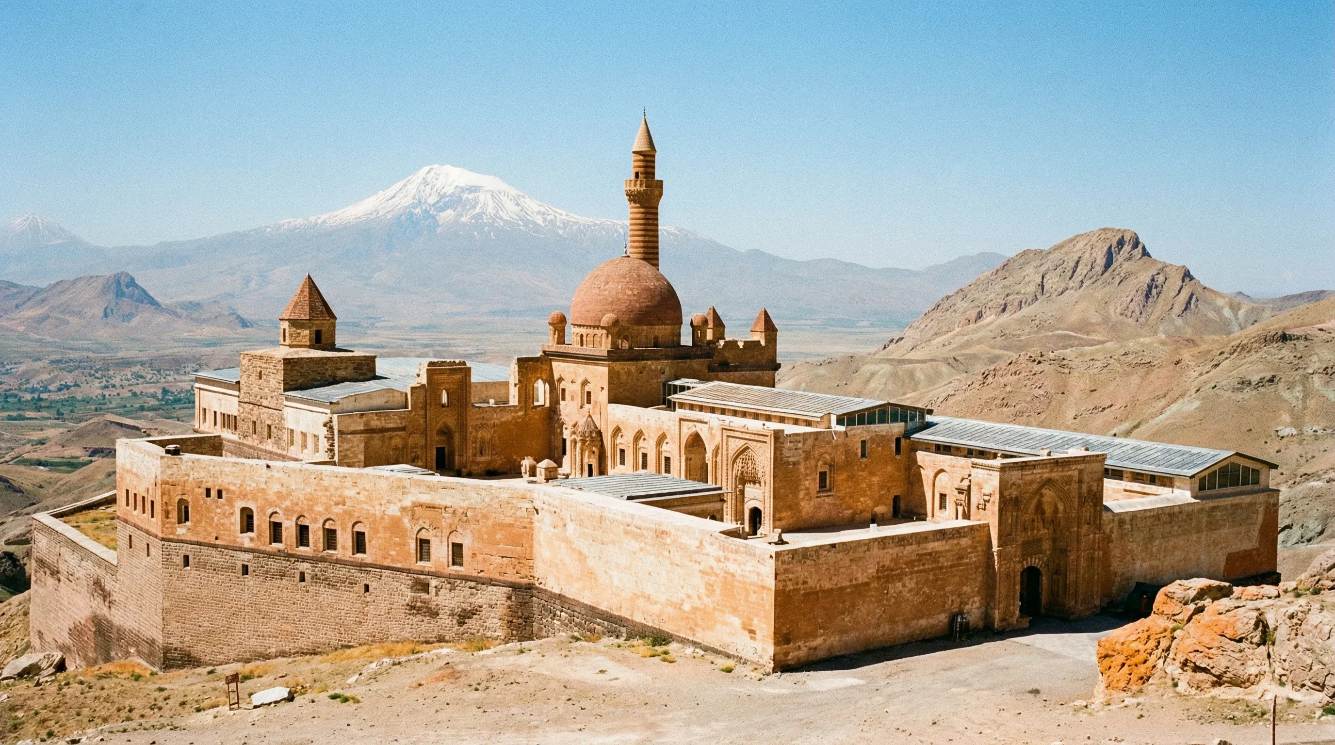 The Ishak Pasha Palace with its domes and minaret located on a rocky hilltop in Eastern Anatolia.