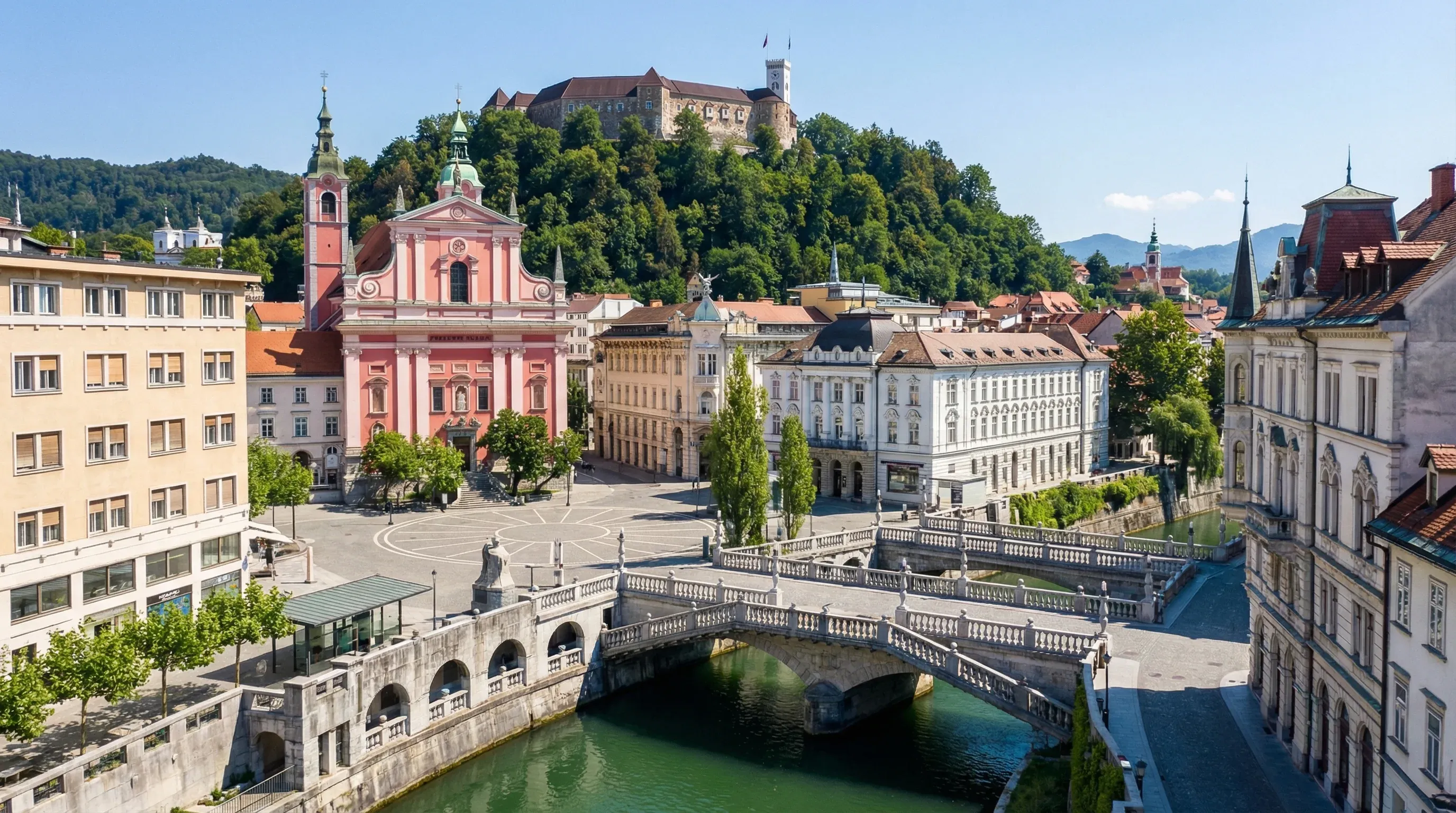 The Triple Bridge crossing the Ljubljanica River in central Ljubljana, with the pink Franciscan Church and the castle hill in the background.