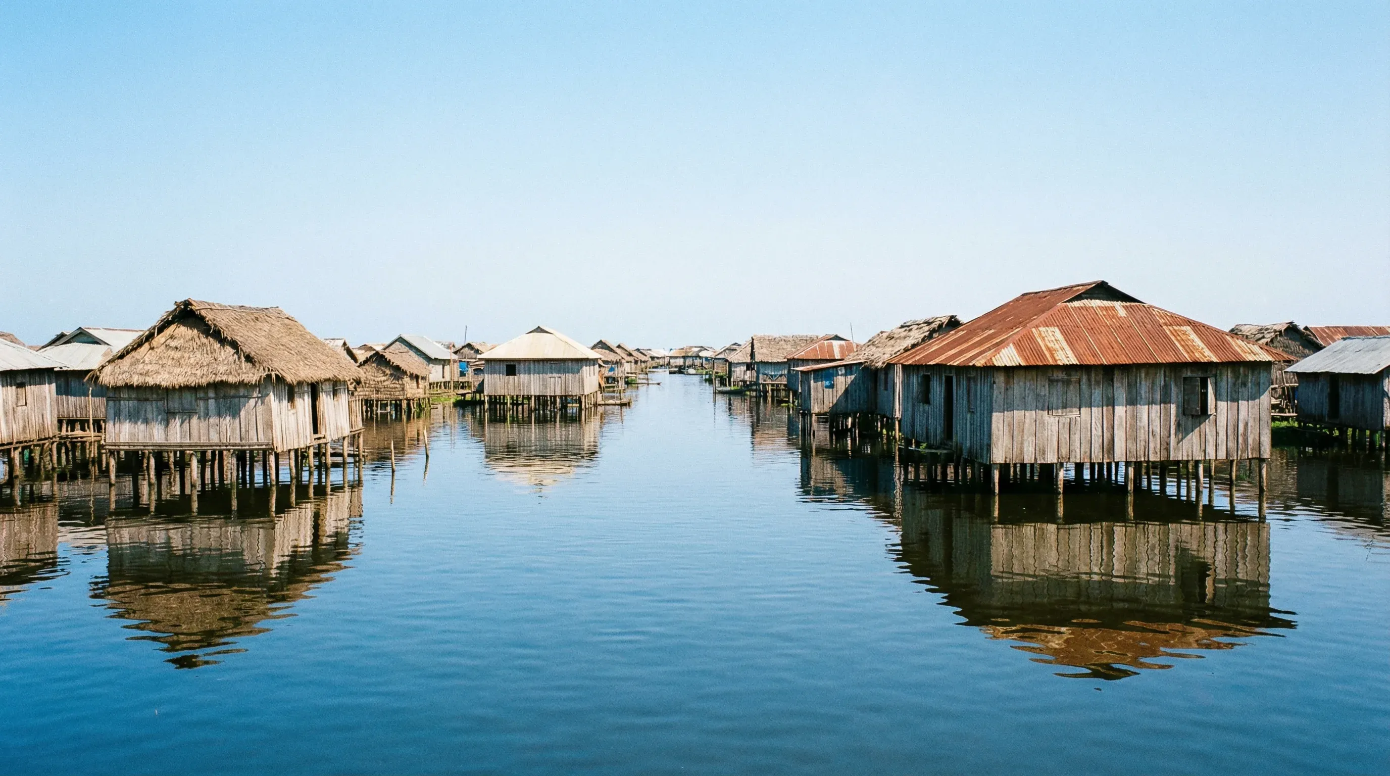 A wide view of traditional wooden houses built on stilts over Lake Nokoué in Ganvié, Benin.