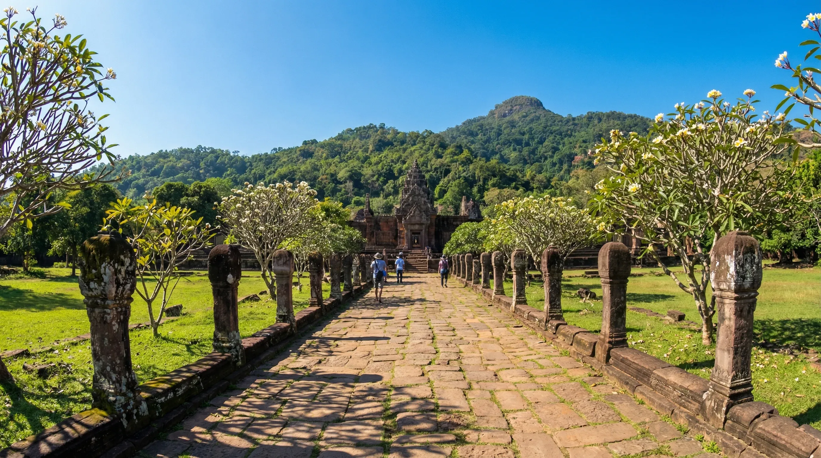 The ancient stone ruins and processional walkway of Wat Phou, a Khmer temple site in Southern Laos.