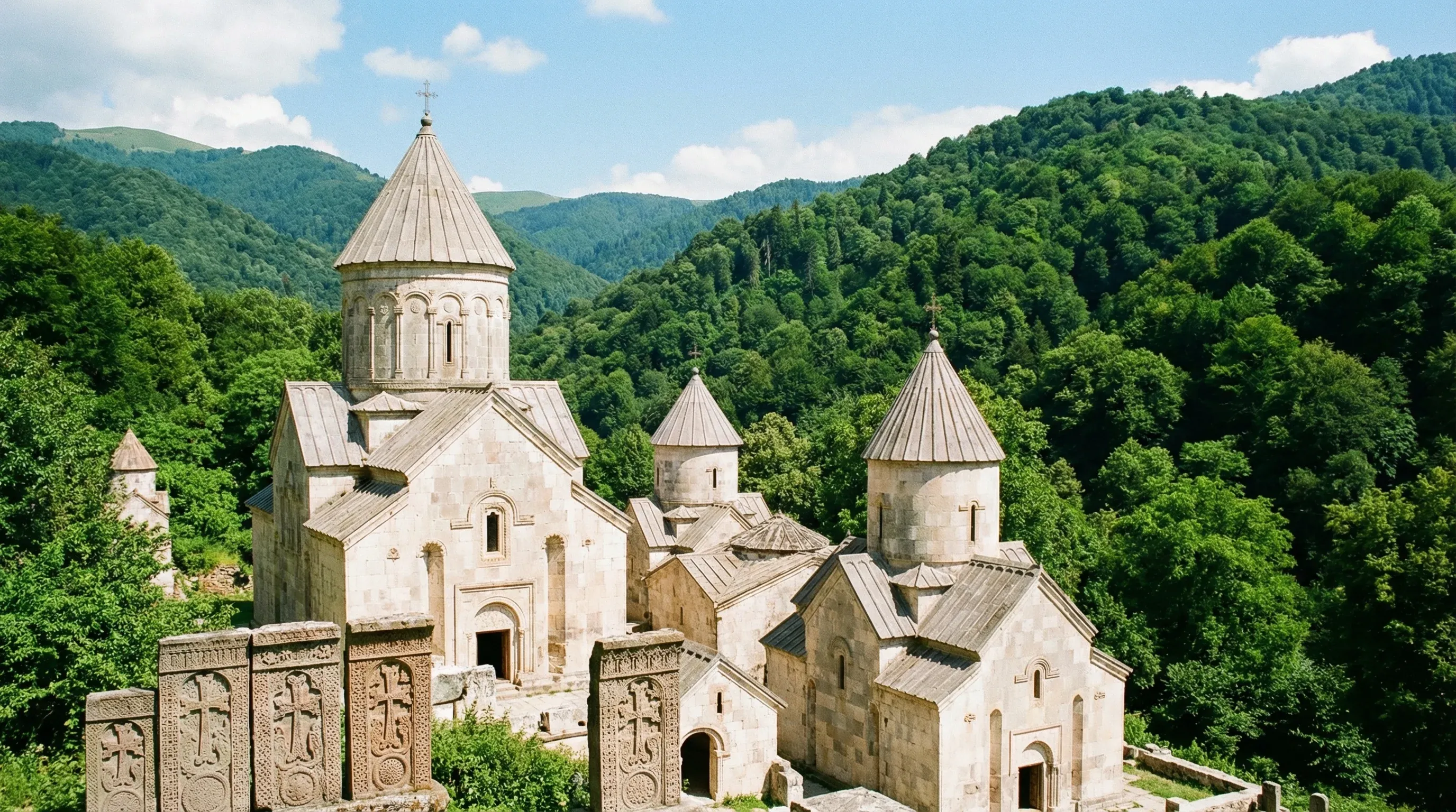 The light stone buildings of Haghartsin Monastery are surrounded by the dense green forest of Dilijan National Park.