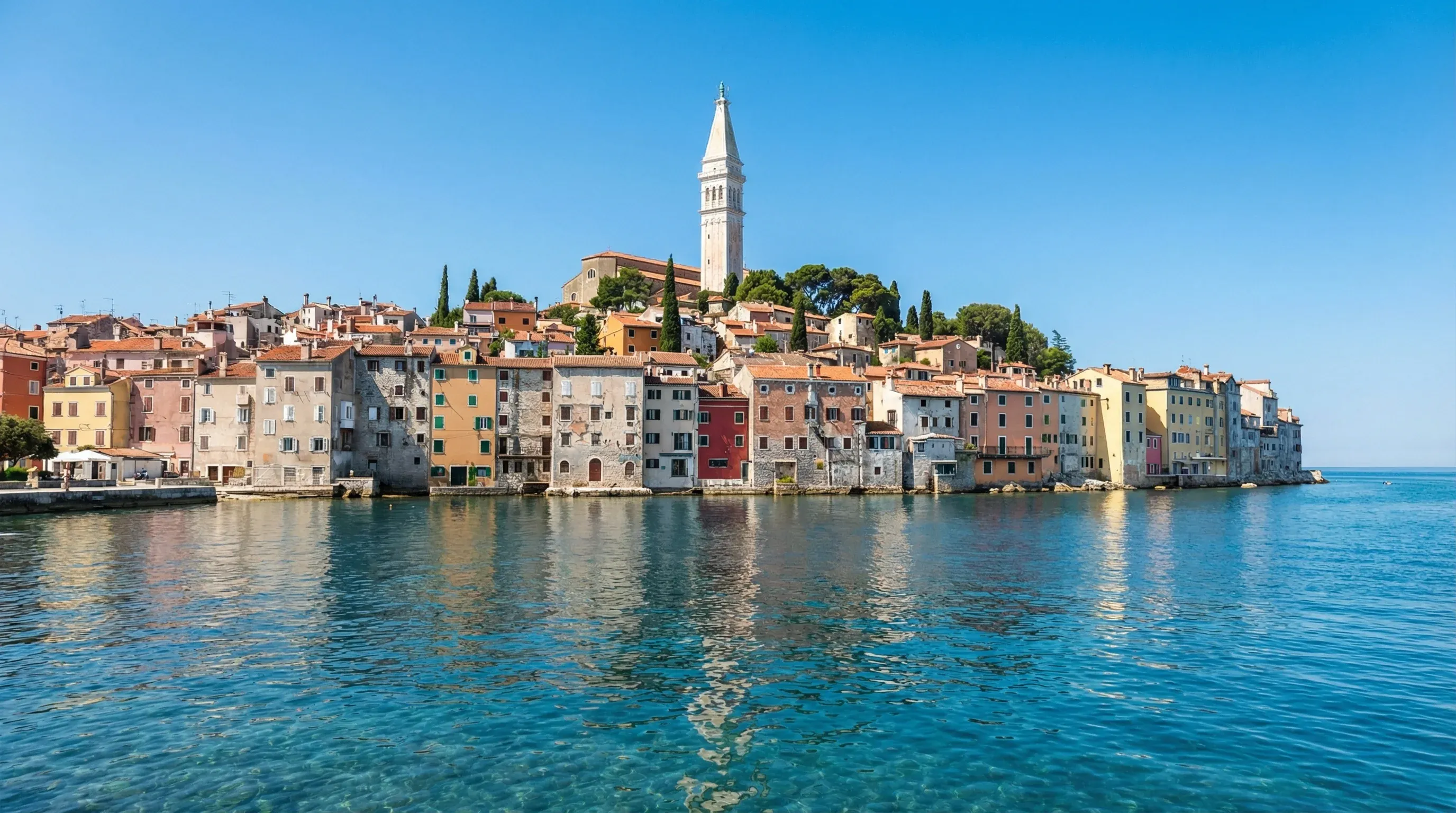 The historic old town of Rovinj with its high bell tower and colorful coastal houses on the Istrian peninsula.