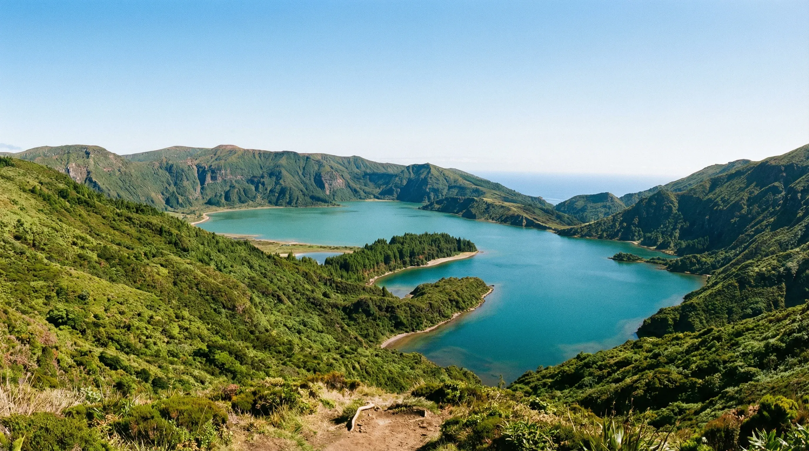 View of the green and blue twin lakes of Sete Cidades within a volcanic crater on São Miguel Island, Azores.
