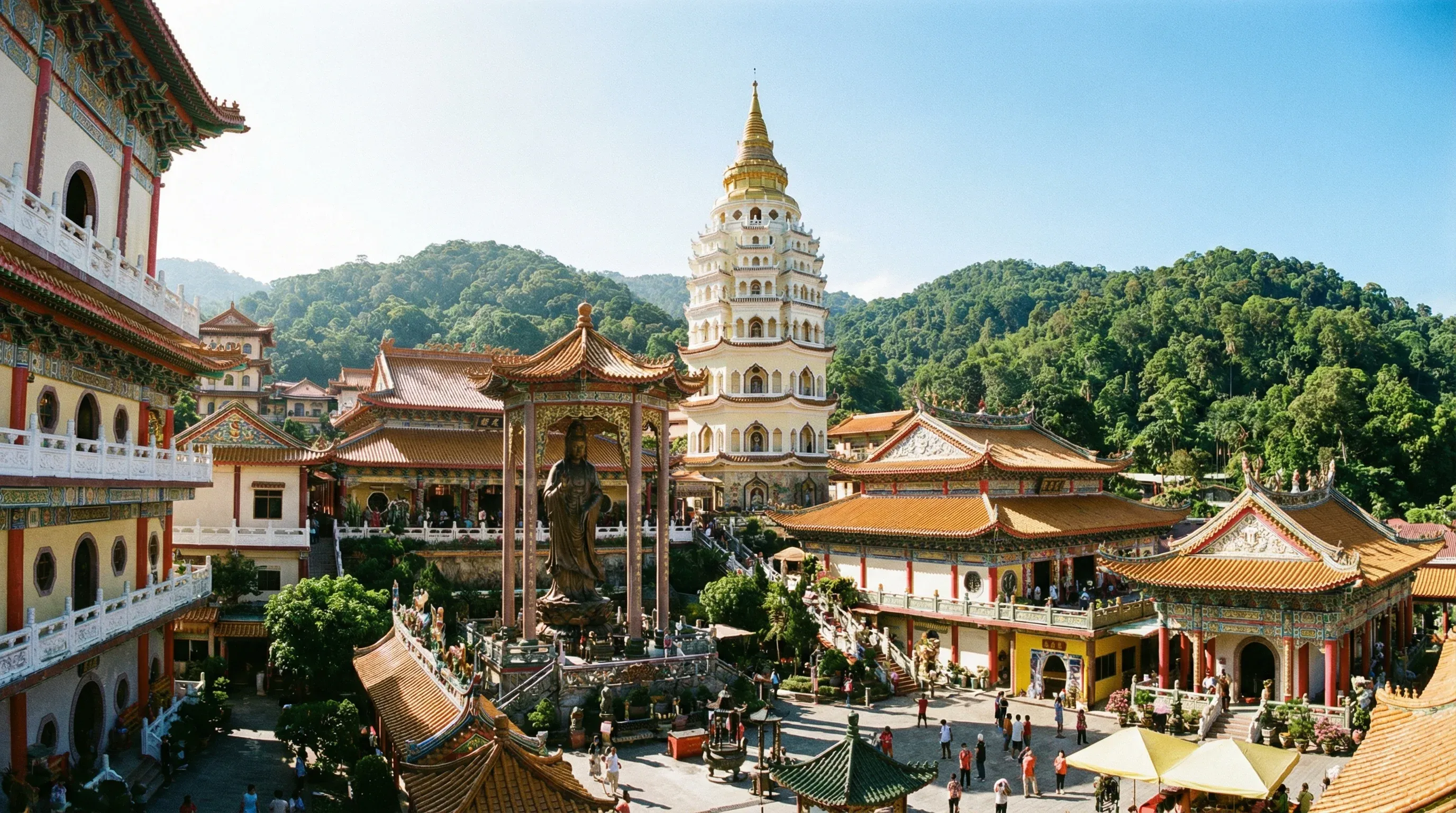 The tiered pagoda and ornate Chinese temple structures of Kek Lok Si on a hillside in Penang.