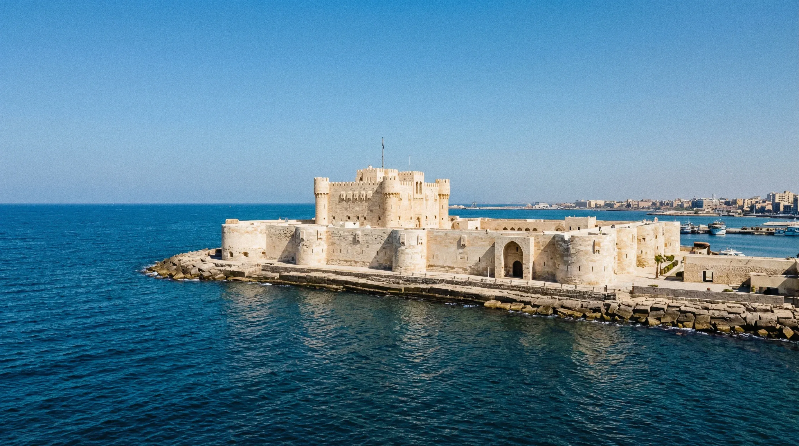 The limestone walls and towers of the Citadel of Qaitbay on the Mediterranean coast in Alexandria.