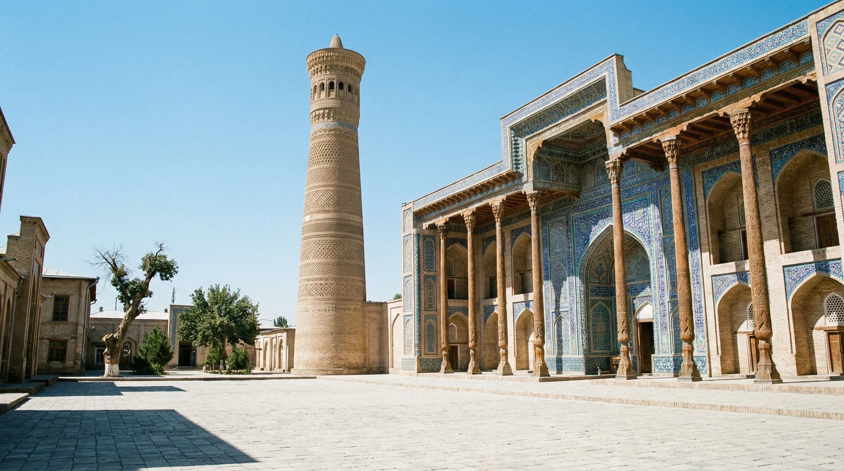 The traditional brick minaret and blue-tiled mosque of the Sheikh Muslihiddin complex in Khujand.