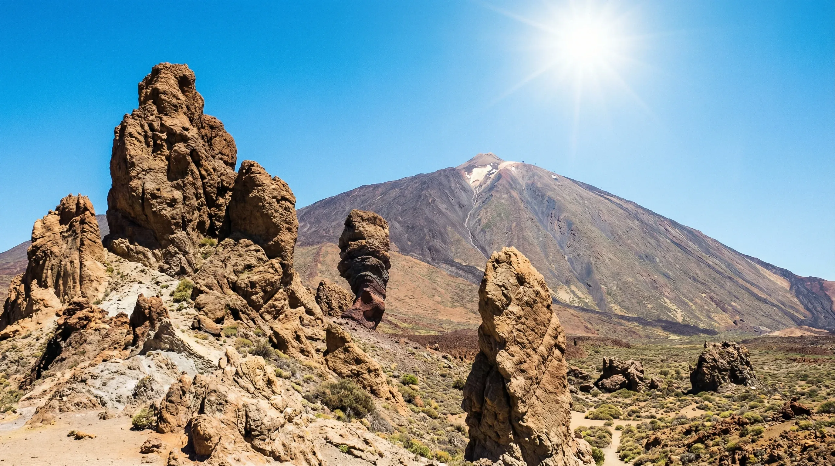 Mount Teide volcano rising above the volcanic rock formations and plains of Teide National Park in Tenerife.