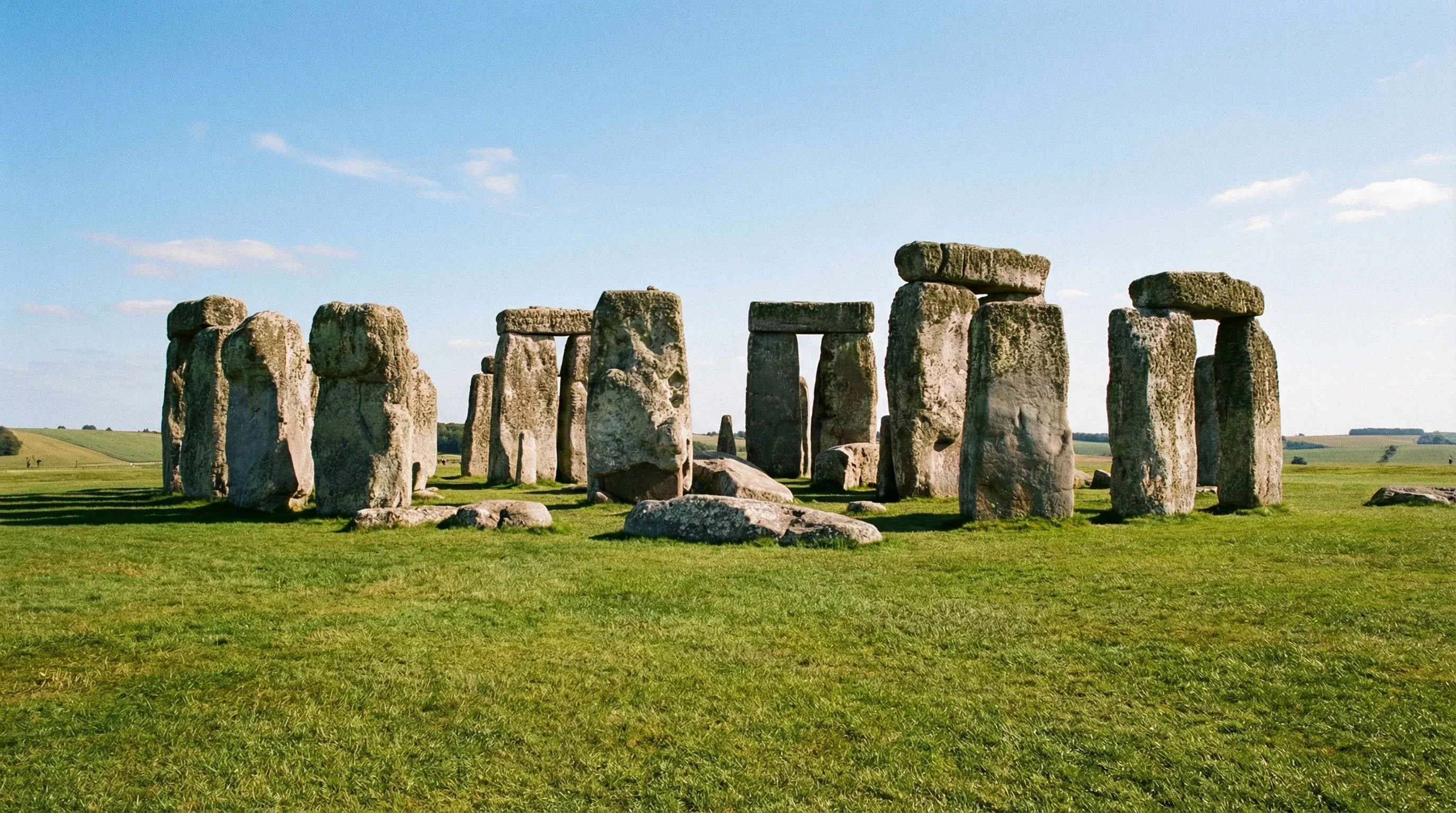 The prehistoric standing stone circle of Stonehenge on a grassy plain in Wiltshire, England.