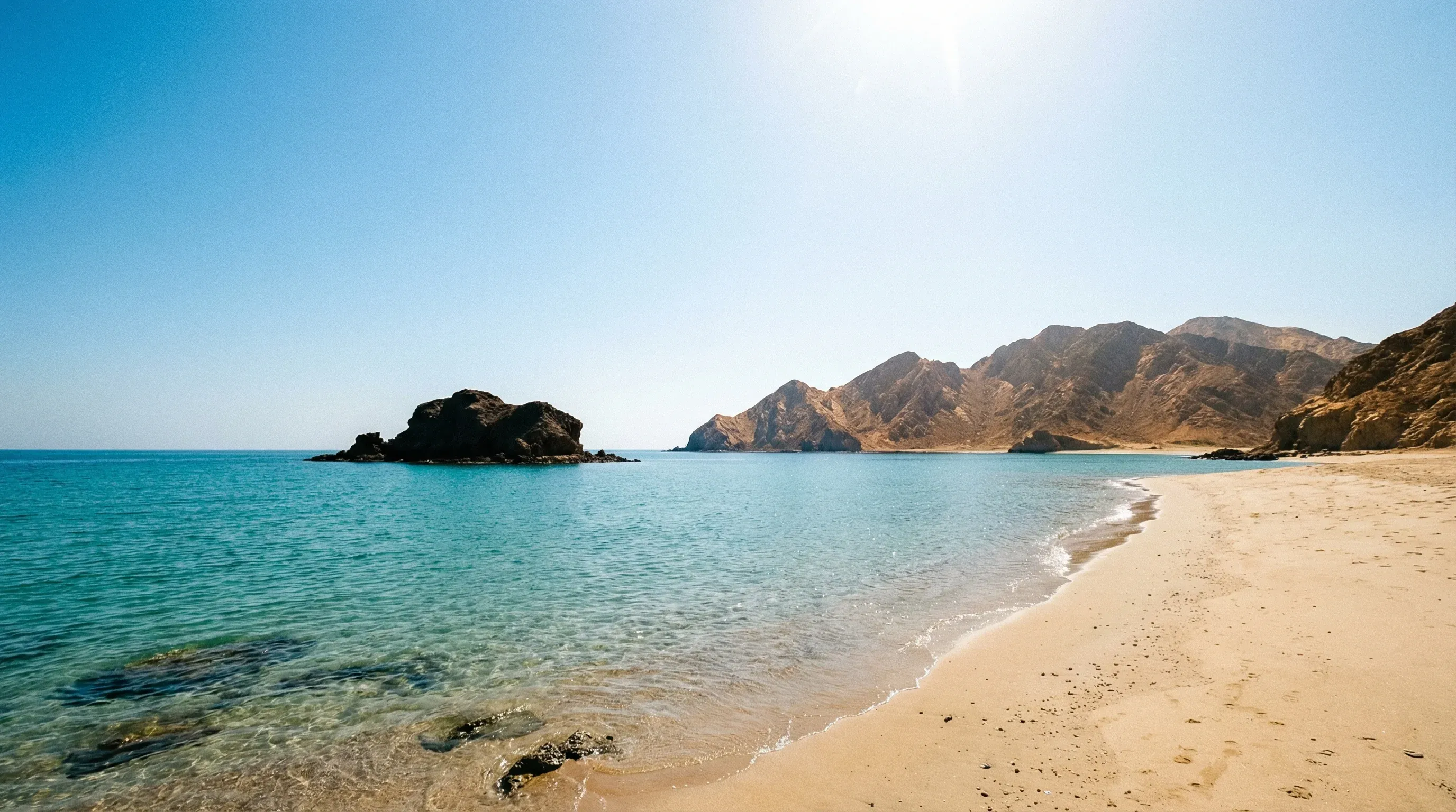 The rocky outcrop of Snoopy Island in the turquoise waters of the Gulf of Oman off the Fujairah coast.