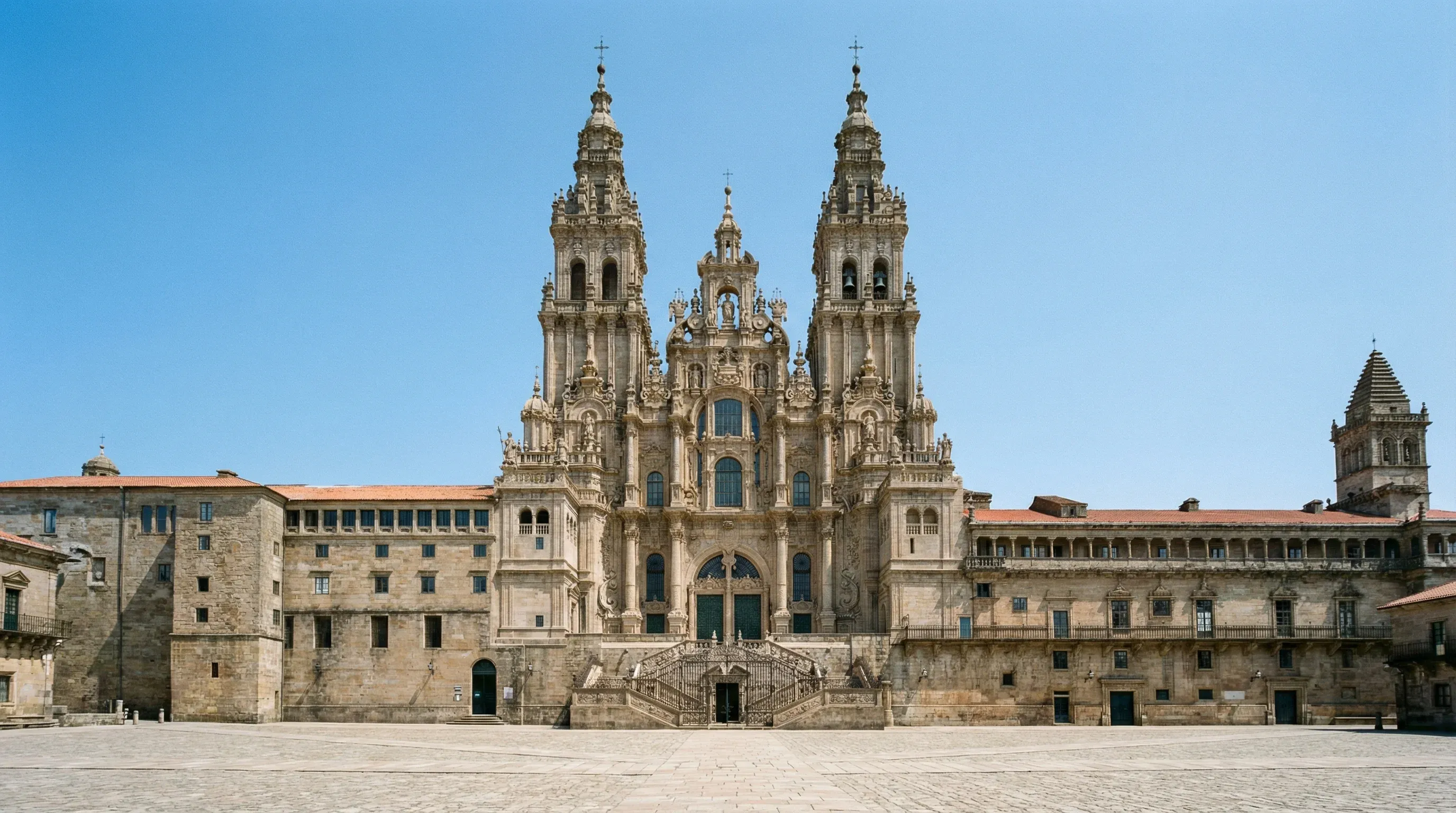 The Baroque facade and twin towers of the Santiago de Compostela Cathedral in the Praza do Obradoiro.