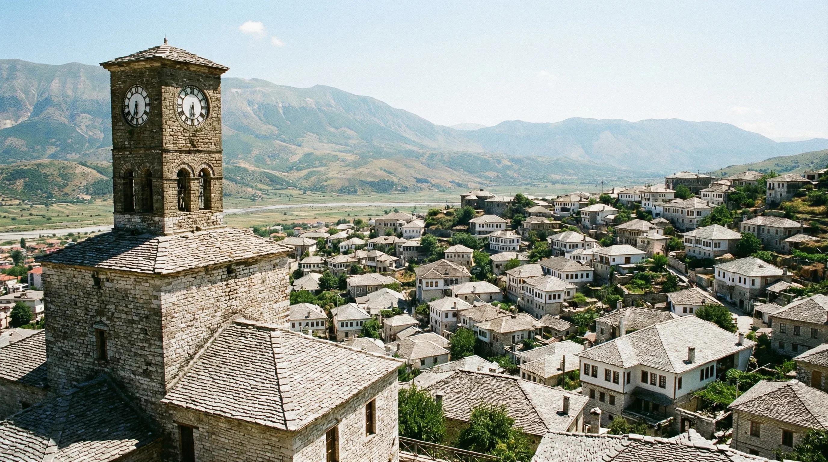 A view from Gjirokastër Castle overlooking the historic town's unique stone-roofed houses and the Drino Valley.