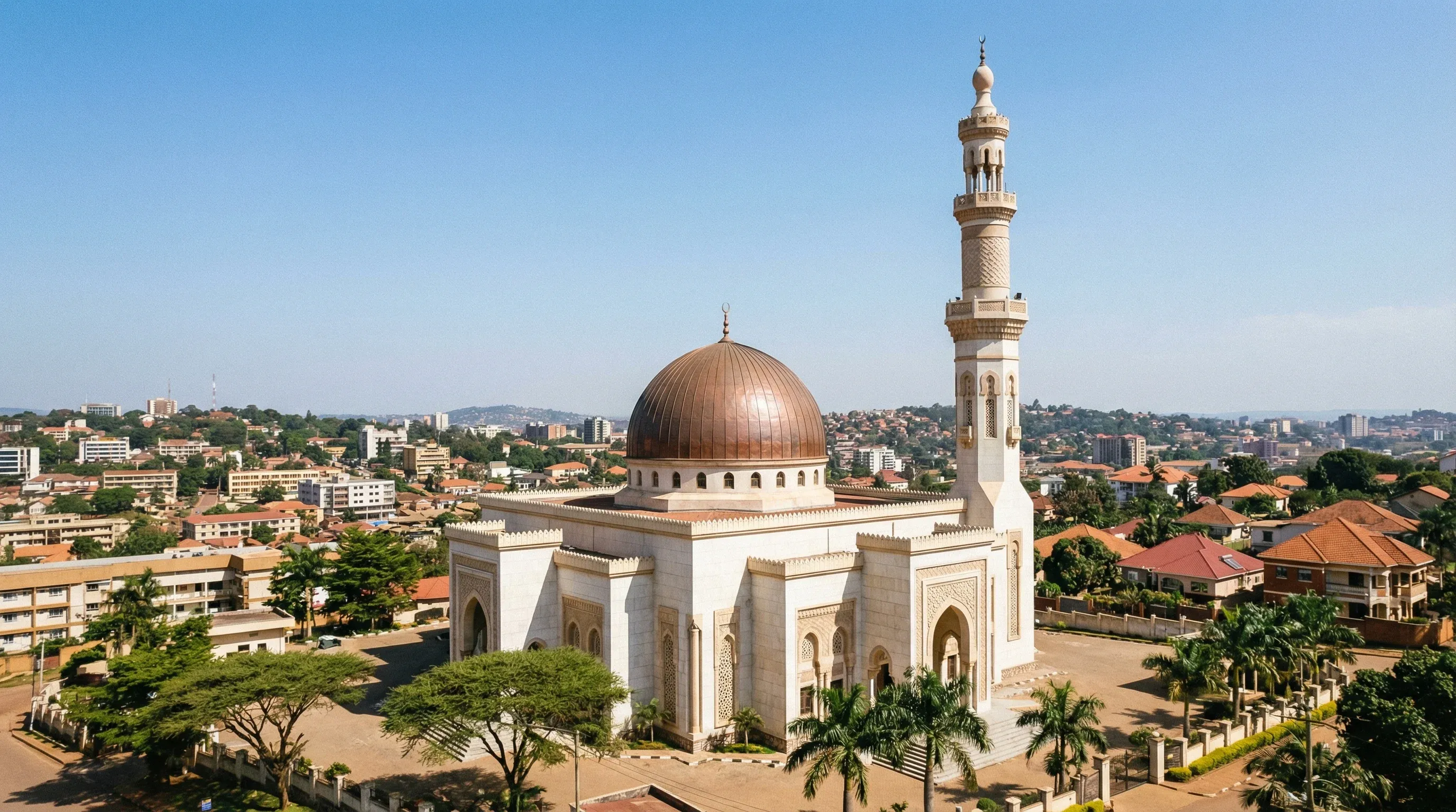 The large dome and minaret of the Uganda National Mosque overlooking the city hills of Kampala.