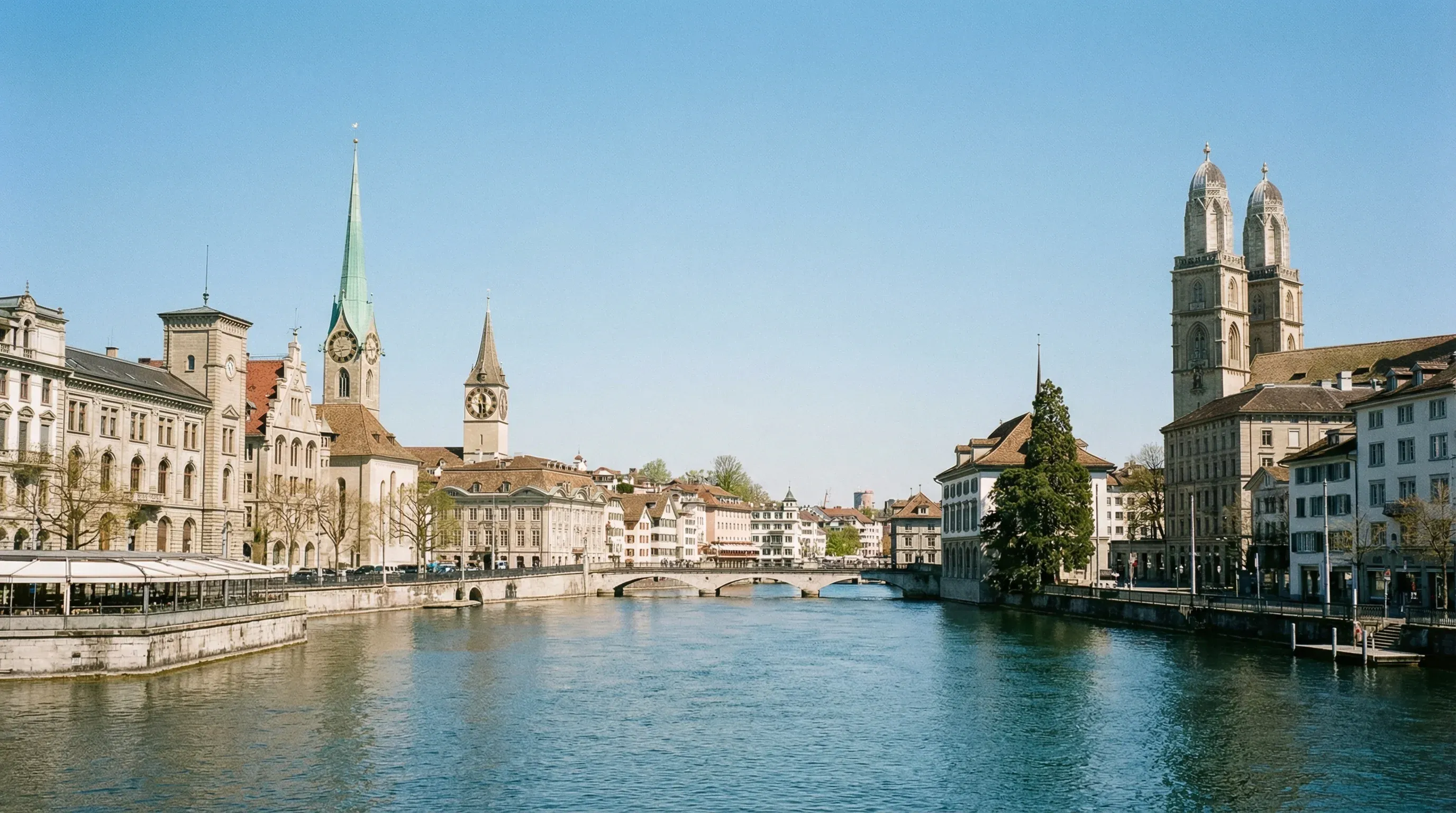 The twin-towered Grossmünster cathedral overlooking the Limmat River and the old town of Zurich.