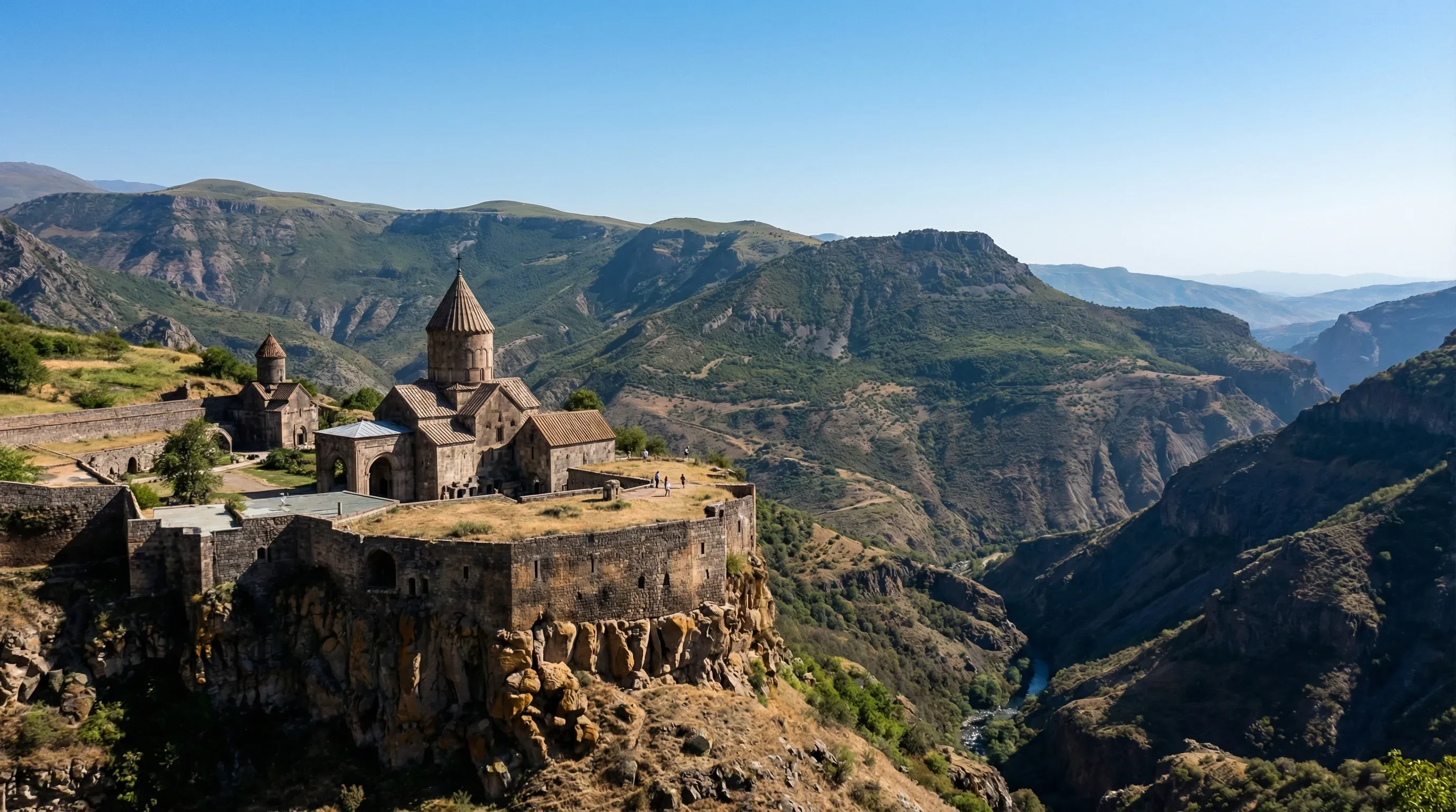 Tatev Monastery sits on a high cliff edge overlooking the deep Vorotan River Gorge in the mountains of southern Armenia.