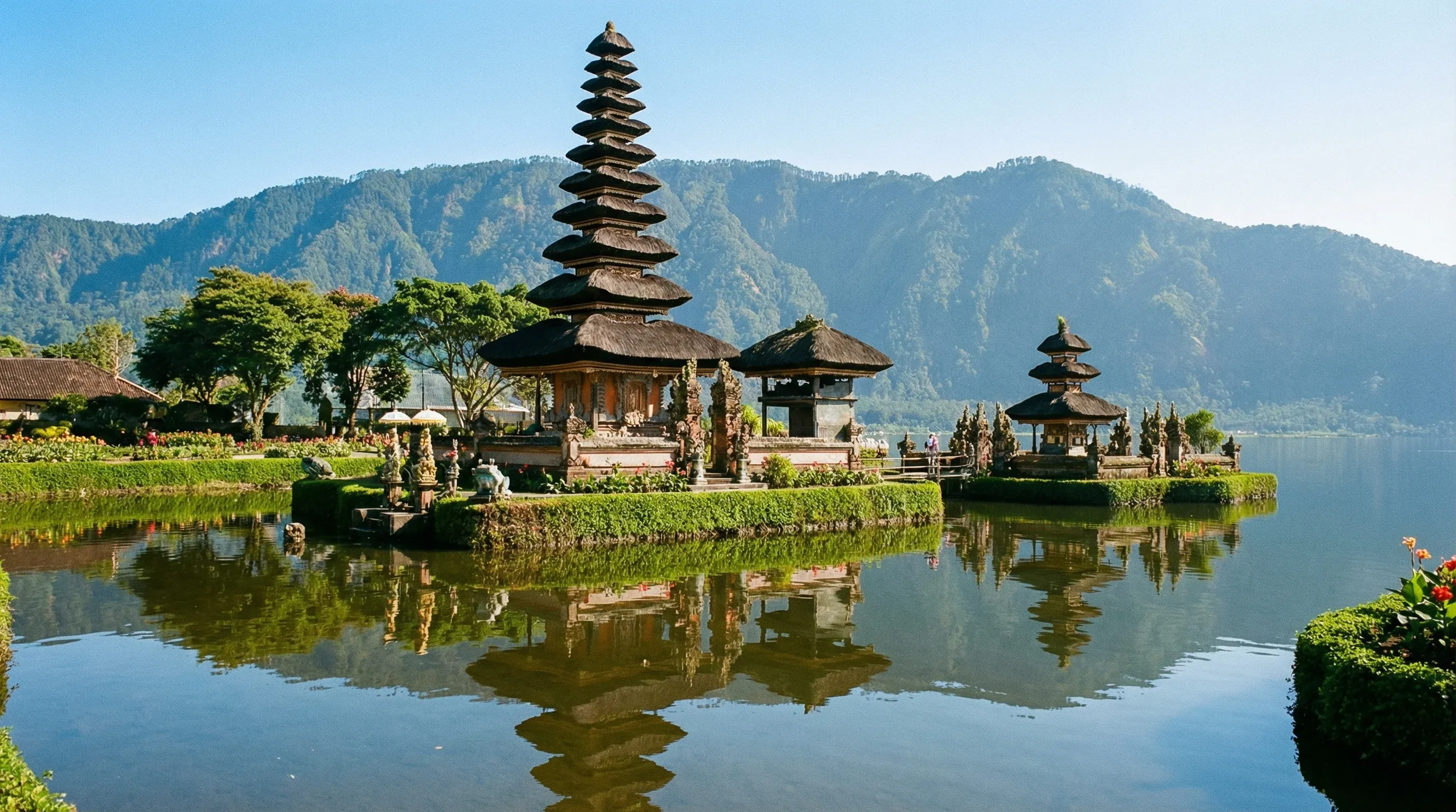 The Pura Ulun Danu Beratan water temple on Lake Bratan, Bali, featuring tiered shrines and mountain backdrops.